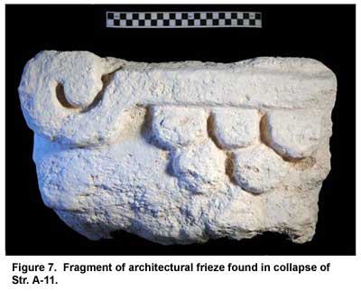 Figure 7. Fragment of architectural frieze found in collapse of Str. A-11. Click to enlarge.